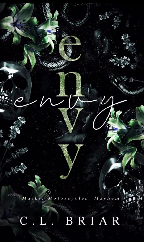 Dark romance book cover of Envy by C.L. Briar featuring snakes, skulls, lilies, and gothic floral design with green and black tones; tagline reads “Masks. Motorcycles. Mayhem.”